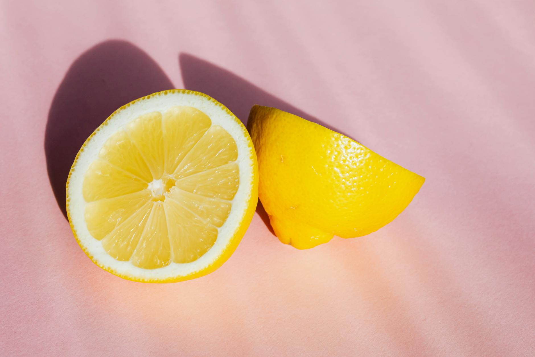 Yellow lemon-shaped vibrator on a warm background with soft lighting